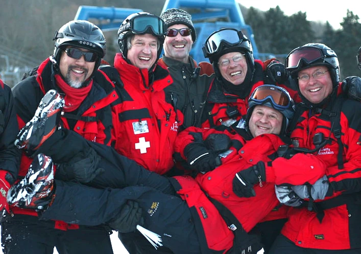 Ski patrol crew wearing Mountain Uniforms outerwear